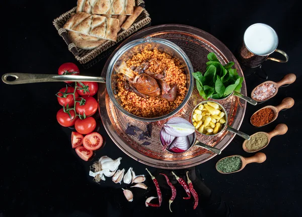 Traditional Turkish Food Lamb shank and rice. Slow cooked lamb shank. Lamb shank served on a Copper tray and in a Copper bowl.