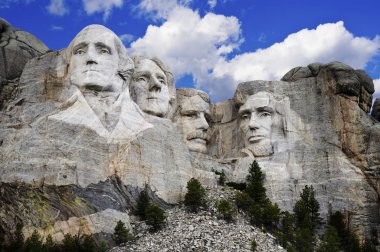 Mt. Rushmore National Memorial Park in South Dakota with bright blue sky in background. clipart