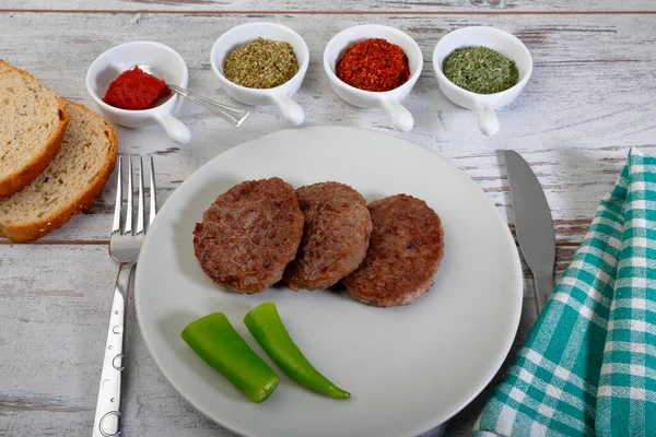 Grilled meat balls. Food service prepared with tomato sauce and spices.