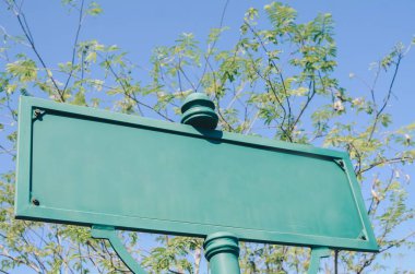 Blank street signwith blue sky background
