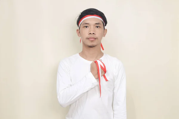 Young Indonesian Man Hands Chest Celebrating Independence Day — Stockfoto