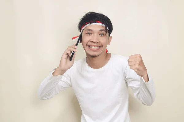 Indonesian Man Smiling While Calling Independence Concept — Stok fotoğraf