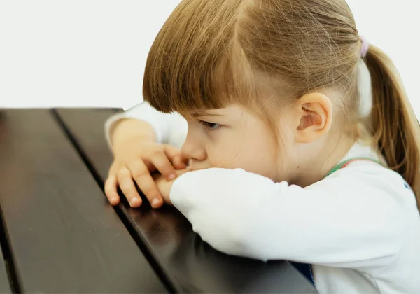 Tired Cute Little Girl Bored Sitting Wooden Table Cafe Angry — Stock Photo, Image