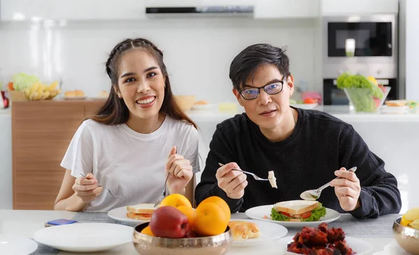 Young Asian Couple Happy Sit Eat Dining Table Kitchen Home — Fotografia de Stock