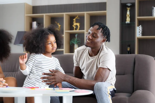 Caring Black Father Helps His Adorable Little Daughter Sit Sofa — Stock Photo, Image