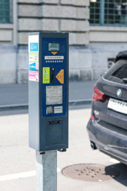 Paid payment for parking in Zurich city. Payment machine at parking lot by street.