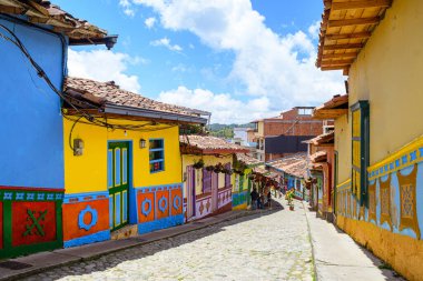 colorful street of guatape colonial town, colombia
