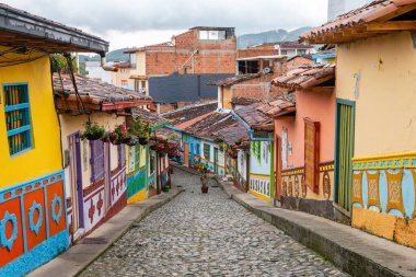 colorful street of guatape colonial town, colombia