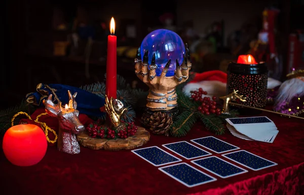 Winter Christmas prediction on a Candle and Tarot cards. Magical esoteric concept. Astrology and wicca rituals