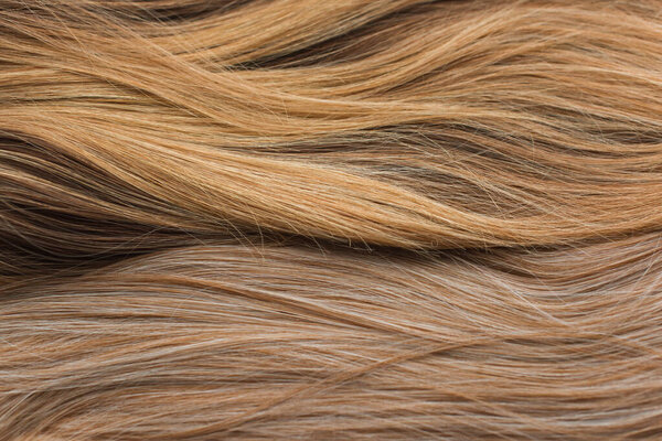 Wigs, natural and synthetic hair. Women's beauty concept. Close up photo of wig, hair for ladies