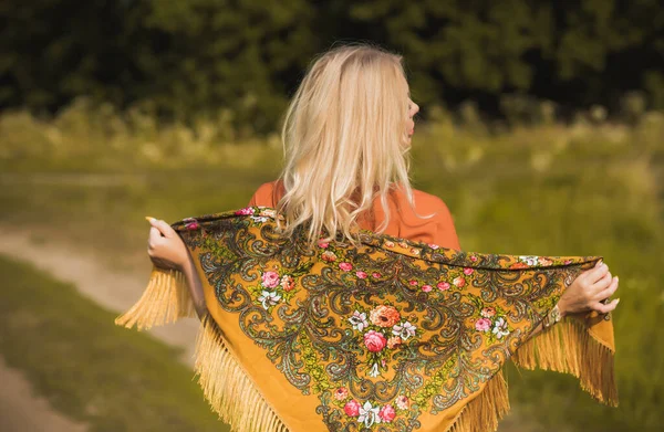 Ethnic gypsy woman posing in boho style clothes at nature. Outdoor fashion. Concept of ethnos style