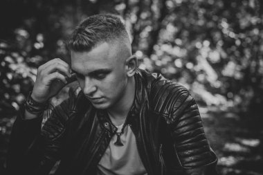  Young European man with a sad philosophical mood. The concept of life, problems and depression. Crisis of young age
