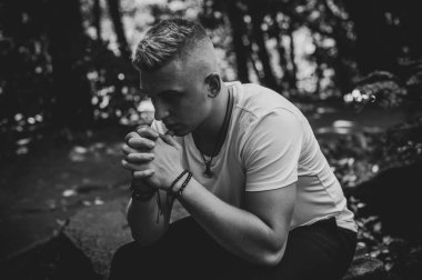  Young European man with a sad philosophical mood. The concept of life, problems and depression. Crisis of young age