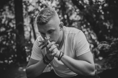  Young European man with a sad philosophical mood. The concept of life, problems and depression. Crisis of young age