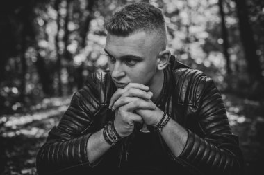  Young European man with a sad philosophical mood. The concept of life, problems and depression. Crisis of young age