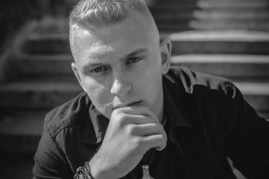  Young European man with a sad philosophical mood. The concept of life, problems and depression. Crisis of young age