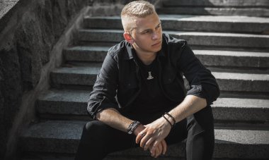 Young European man with a sad philosophical mood. The concept of life, problems and depression. Crisis of young age