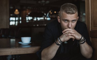  Young European man with a sad philosophical mood. The concept of life, problems and depression. Crisis of young age