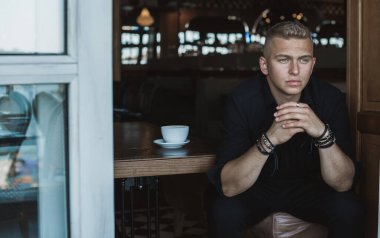  Young European man with a sad philosophical mood. The concept of life, problems and depression. Crisis of young age