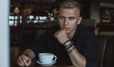  Young European man with a sad philosophical mood. The concept of life, problems and depression. Crisis of young age