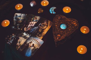 Magical attribute of modern witch, witchcraft concept. Tarot cards and other rituals. Illustrative editorial. Europe, Ukraine, Kiev. August 24