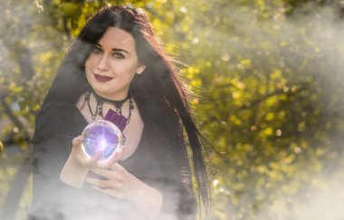 Halloween time, witch Lady in Mystical atmosphere, witchcraft concept, ideas for mysterious Party. Addams family 