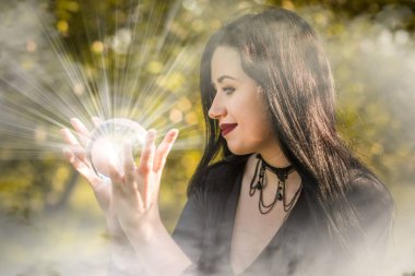 Halloween time, witch Lady in Mystical atmosphere, witchcraft concept, ideas for mysterious Party. Addams family 