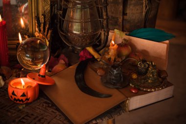 Halloween composition pumpkin orange candles, mystical design for home, interesting ideas for party, details of dcor