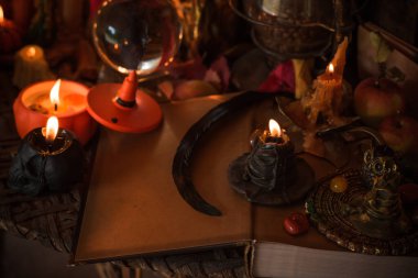 Halloween composition pumpkin orange candles, mystical design for home, interesting ideas for party, details of dcor