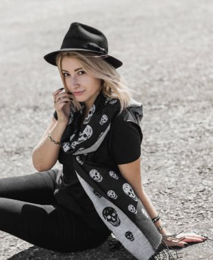 A young woman in leather jacket. Concept of grunge style 90x, mix clothes, outfits for women