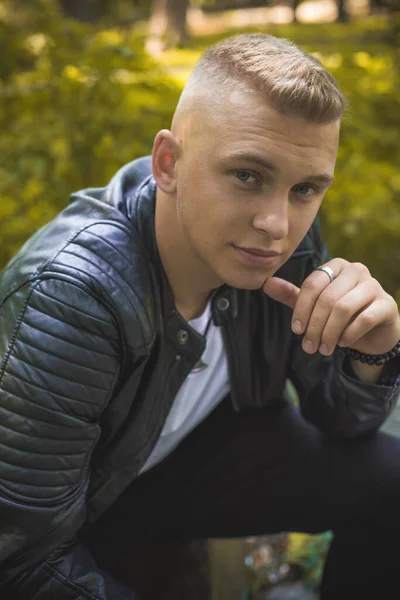 Young blonde Nordic appearance guy, style for youth accessorize for men, casual street style