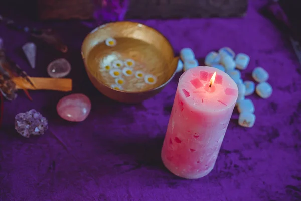 Candle burns on the altar, candles magic, clean aura and negative energy, wicca concept