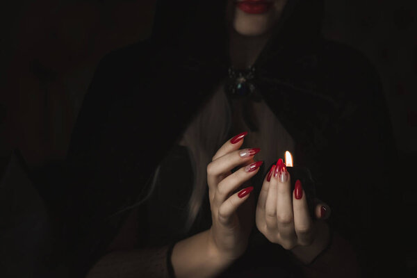 Close up woman's hand with Halloween gothic vampire manicure . Details for Halloween party concept