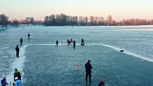 Children Playing Hockey Frozen River Ice — Stock Video