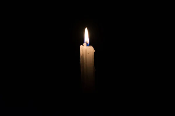 Isolated One Single Candle Closeup Dark Flame Paraffin Candle Church — Stockfoto