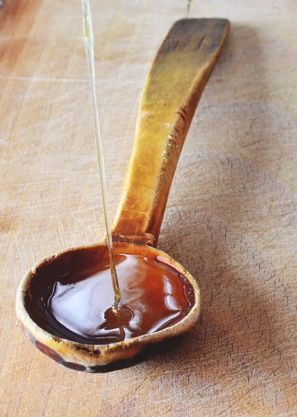 Fresh Natural Organic Honey Being Poured Wooden Spoon — стоковое фото