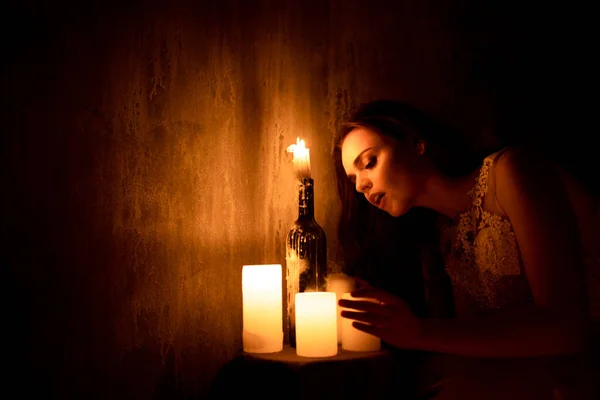 Woman Sitting Room Candlelight Young Girl Looks Burning Candles Wonders — Stock Photo, Image