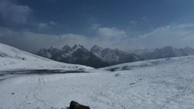 Mountain Scenery From The Snow-covered Sar Pass Top In The Indian Himalayas, Himachal Pradesh, India. wide aerial. High quality FullHD footage