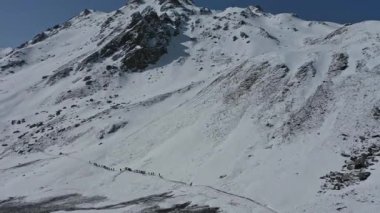 Hikers Trekking Through Steep Mountain Trail Of Sar Pass - aerial shot. High quality FullHD footage