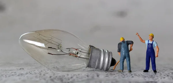 Light Bulb Miniature People Business Concept Miniature Man Raising His — Stock Photo, Image