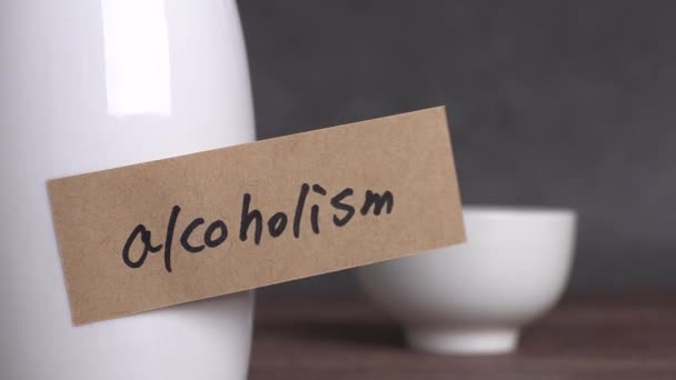 Alcoholism Text Paper Glass Bottle Concept Alcoholism Warning — Stockvideo