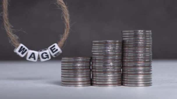 Three Piles Graph Shaped Coins Wage Text White Cube Swinging — Video