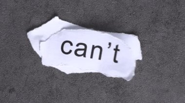 Replace the word CAN'T with the word CAN. Business concept with letters and wobbly paper.