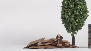 The concept of the gap between rich and poor. Business concept with piles of coins and miniature people.