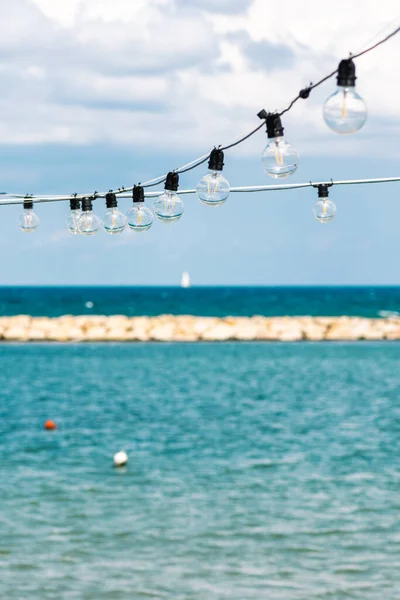 Vintage Light Bulbs Blue Sky White Clouds Blue Sea Sail — Stok fotoğraf