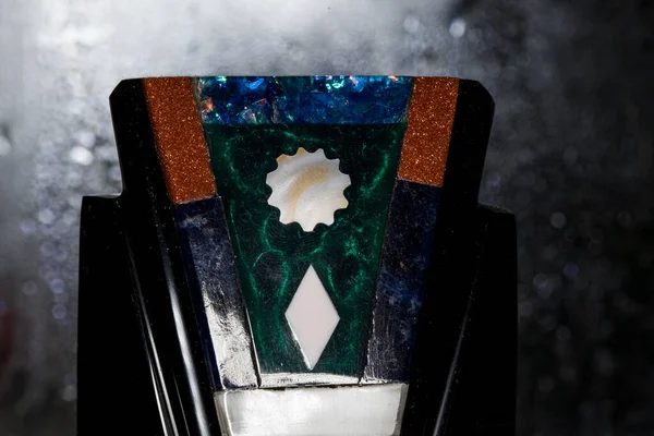 Obsidiyen heykelleri tasvir eden bir hatıra, volkanik bir kaya, biçimsiz, camsı siyah, gümüş ya da altın, Aztekler tarafından tanrıların heykellerini yapmak için kullanılır..