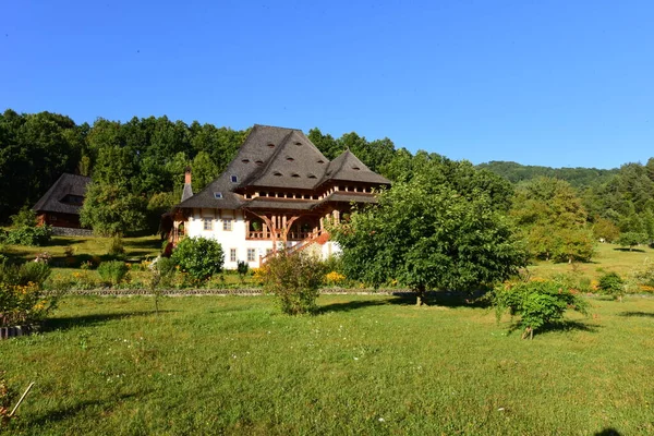 The Orthodox Monastery from Brsana is a monastic complex that hosts in the natural space, dominated by red flowers, from Maramure Valea Izei, traditional wooden and stone constructions of the Orthodox cult