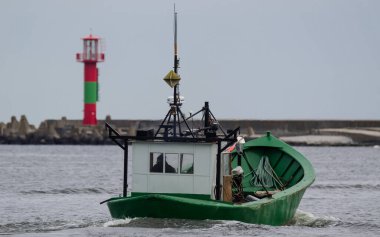 SWINOUJSCIE, WEST POMERANIAN / POLAND - 2020: A fishing boat  go to the sea 