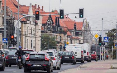 POZNAN - POLAND - 2021: Car traffic at the crossroad with traffic lights