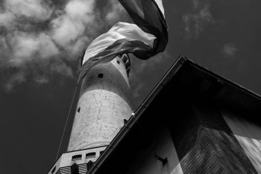 STATE FLAG - Flag of Poland at the lighthouse in Swinoujscie